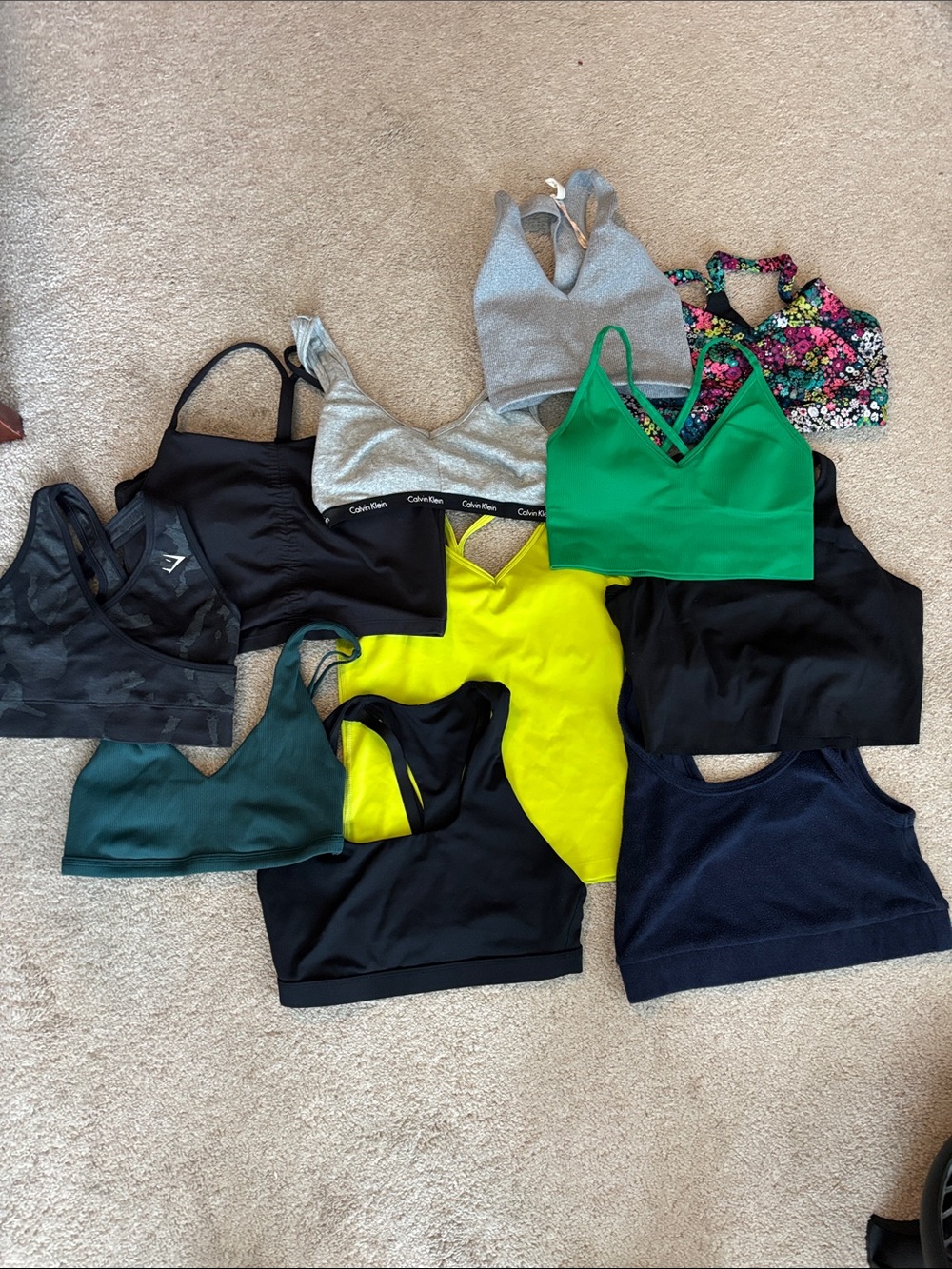 Lot is 11 bra tops. XS and Small. Brands vary. FP, target, DSG, Nike, CK,offline